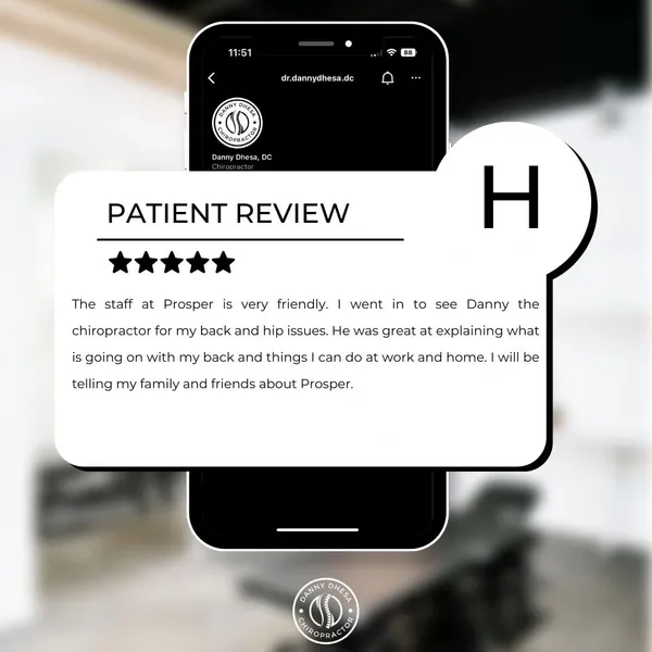 A smartphone displaying a positive review of Danny Dhesa Chiropractor on a website or app, with a focus on the quality of the service and the intention to recommend to others.
